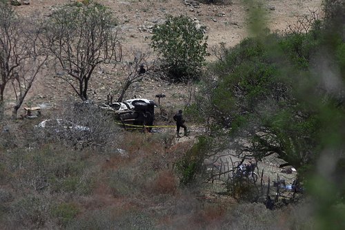 Security authorities work at the scene where security authorities were attacked with explosives, in Tlajomulco de Zuniga