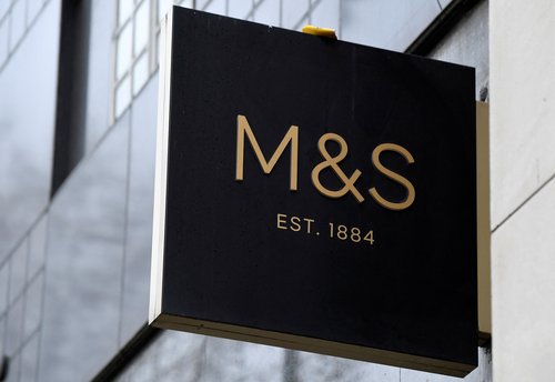 Marks and Spencer (M&S) hangs outside one of their UK stores in London