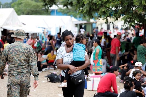 FILE PHOTO: FILE PHOTO:Migrants wait at the Migrants Reception Station in Lajas Blancas, in Panama