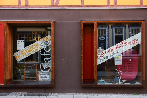A shop with signs against the far-right party AFD is seen on the day of the lord mayor elections in the Thuringian town of Nordhausen
