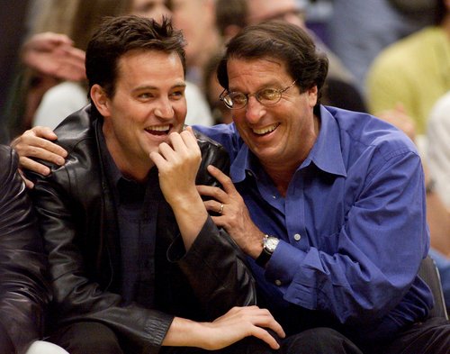 FILE PHOTO: Actor Matthew Perry (L) and studio executive Peter Roth attend Game One of the NBA Finals