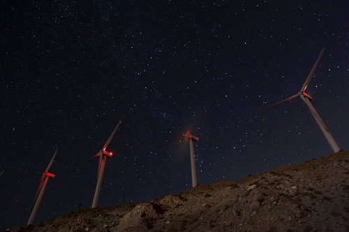 FILE PHOTO: Windmills at the San Gregornio Pass Wind Farm near Whitewater, California are shown in this evening time exposure