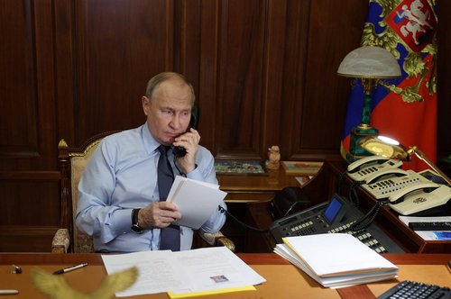 Russia's President Putin speaks on the phone with a participant of a charity event in Moscow