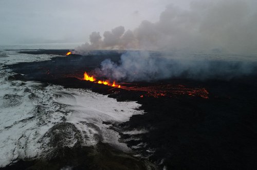 An aerial view of lava spewing from the site of the volcanic eruption north of Grindavik