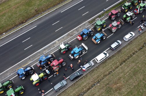 Tractors are lined up during a blockade by farmers on the A4 highway in Jossigny, near Paris