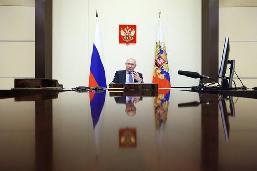 FILE PHOTO: Russian President Vladimir Putin chairs a meeting with members of the government via video link at a residence outside Moscow