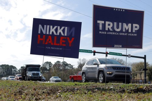 Campaign signs for Republican presidential candidates stand in Mount Pleasant, SC