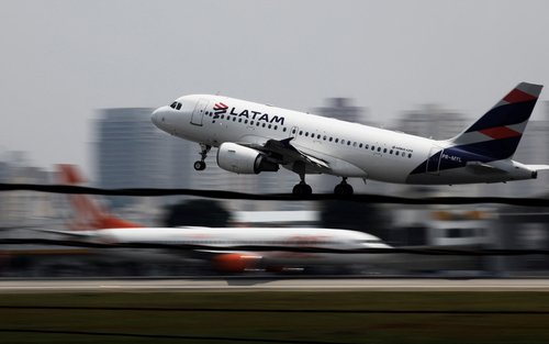 FILE PHOTO: A LATAM Airlines Brasil Airbus A319 plane takes off from Congonhas airport in Sao Paulo, Brazil