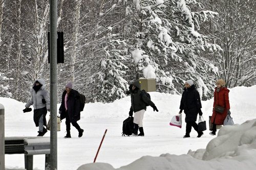 FILE PHOTO: Migrants arrive at the Vaalimaa border check point between Finland and Russia in Virolahti