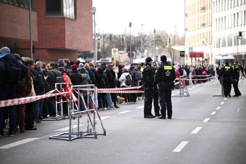 People queue outside the Russian Embassy, in Berlin