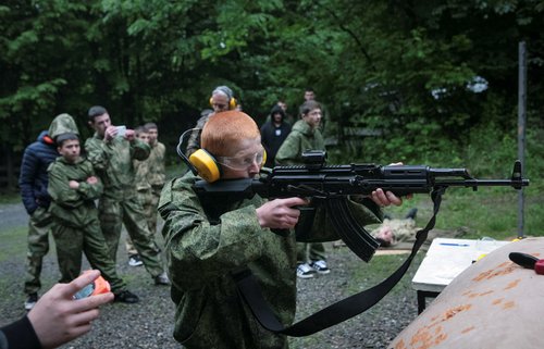 Pupils fire weapons and practise first aid at a range, in Vladikavkaz