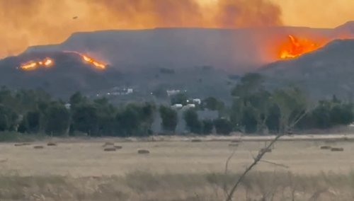 A general view of fire around the island of Kos