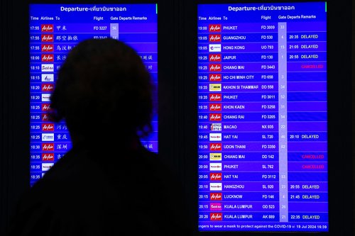 Don Mueang International Airport Terminal 1 amid system outages disrupting the airline's operations in Bangkok