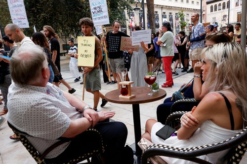 FILE PHOTO: People protest against mass tourism in Alicante