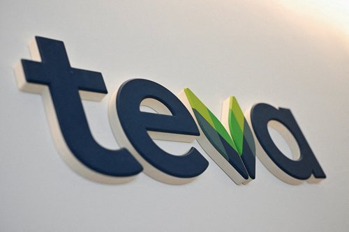 FILE PHOTO: The logo of Teva Pharmaceutical Industries is displayed at the company headquarters in Tel Aviv
