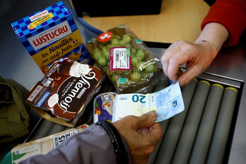 FILE PHOTO: Customers shop in a supermarket in Chanverrie, France