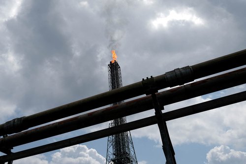 FILE PHOTO: A view shows a tower flaring gas at an LNG processing plant operated by Shell and others in Bonny Island