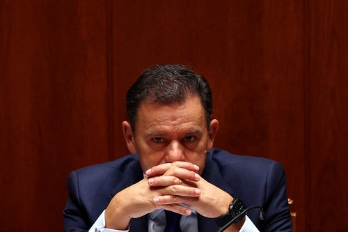 FILE PHOTO: Portugal's Prime Minister Luis Montenegro gestures during the debate on the new elected government program, at the parliament in Lisbon, Portugal, June 18, 2025. REUTERS/Pedro Nunes/File Photo