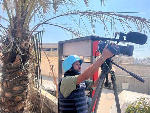Palestinian cameraman Hussam al-Masri, who was a contractor for Reuters and killed in Israeli strikes on Nasser hospital on August 25, 2025, works at Nasser hospital, in Khan Younis in the southern Gaza Strip August 7, 2024.