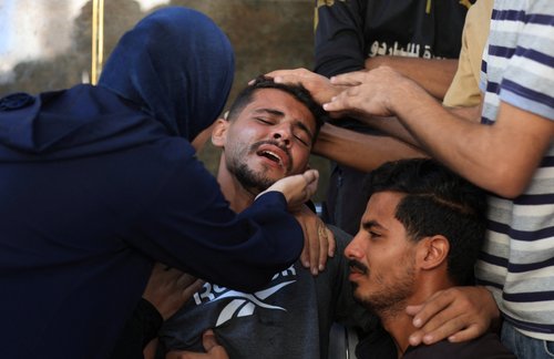 Mourners react during the funeral of Palestinians killed in an overnight strike on a tent, according to medics, at Al-Shifa Hospital in Gaza City, August 29, 2025. REUTERS/Dawoud Abu Alkas