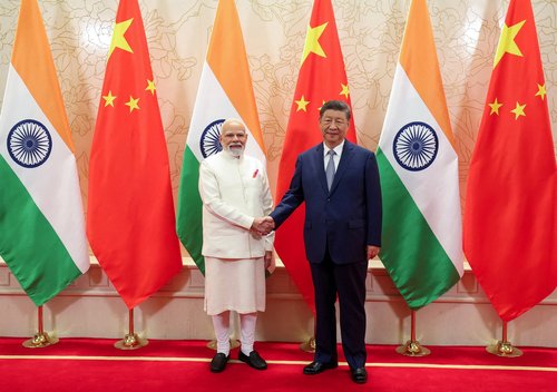India's Prime Minister Narendra Modi shakes hands with Chinese President Xi Jinping