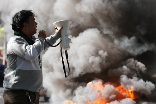 A university student of the Islamic University of Bandung (UNISBA) delivers his speech during a protest against the University rectorate