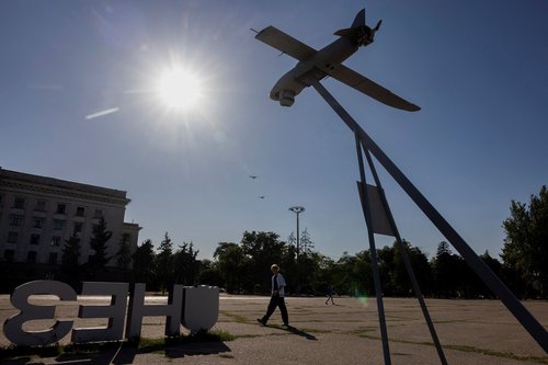A man walks past a captured Russian surveillance drone on display, amid Russia's attack on Ukraine, in the port city of Odesa, Ukraine August 12, 2025. REUTERS/Thomas Peter