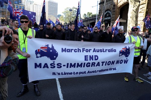 Demonstrators hold a banner during the 'March for Australia' anti-immigration rally, in Sydney, Australia, August 31, 2025.
