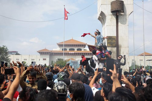 Demonstrators enter Parliament during a protest against Monday's killing of 19 people in Kathmand, Nepal