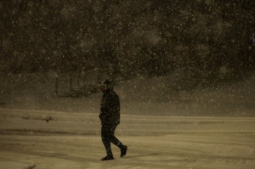 A person walks through the snow as Storm Goretti brings heavy snowfall and rain to Walsall, Britain, January 8, 2026.