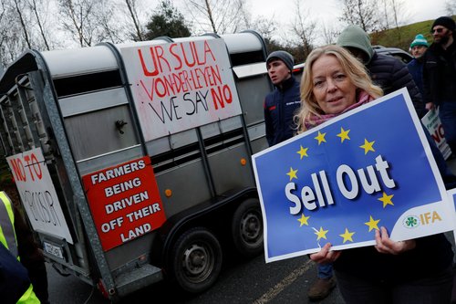 A demonstrator holds a sign as she takes part in a farmers' protest against the EU-Mercosur free trade agreement, in Athlone, Ireland, January 10, 2026.