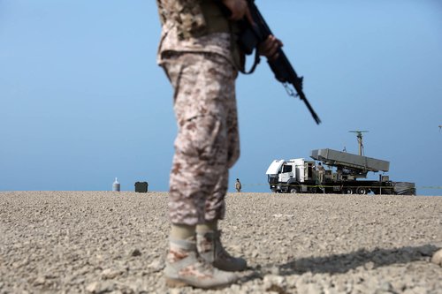 A handout picture provided by the Iranian Army office on August 21, 2025, shows a a soldier standing near a rocket launcher during a military drill in an undisclosed location in southern Iran.