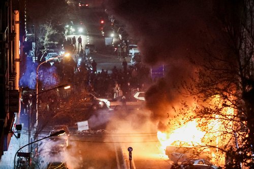 Cars burn in a street during a protest over the collapse of the currency's value, in Tehran, Iran, January 8, 2026. Stringer/WANA (West Asia News Agency) via REUTERS ATTENTION EDITORS - THIS PICTURE WAS PROVIDED BY A THIRD PARTY