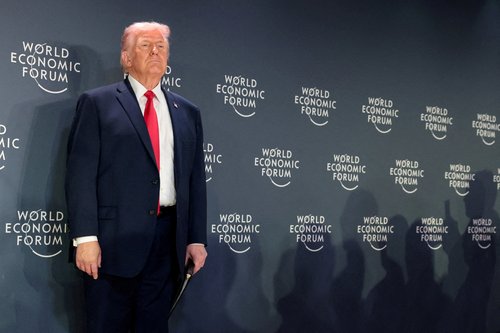 FILE PHOTO: U.S. President Donald Trump attends a reception with business leaders during the 56th annual World Economic Forum (WEF), in Davos, Switzerland, January 21, 2026. REUTERS/Jonathan Ernst/File Photo