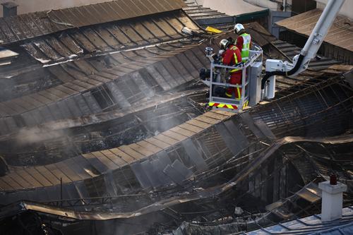 French firefighters conduct safety operations at the Marche des Enfants Rouges market in central Paris after it was destroyed by a fire, in Paris, France, October 12, 2026. REUTERS/Sarah Meyssonnier