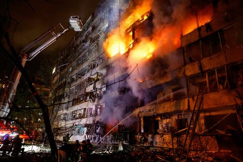 Firefighters work at the site of an apartment building damaged by a Russian missile strike, amid Russia's attack on Ukraine, in Kyiv, Ukraine October 14, 2026. REUTERS/Valentyn Ogirenko
