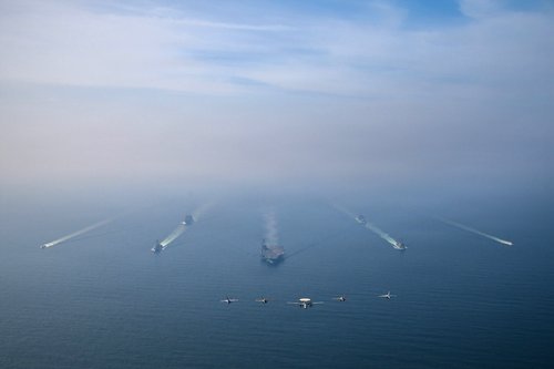 The U.S. Navy's Nimitz-class aircraft carrier USS Abraham Lincoln leads its strike group during a photo exercise in the Arabian Sea