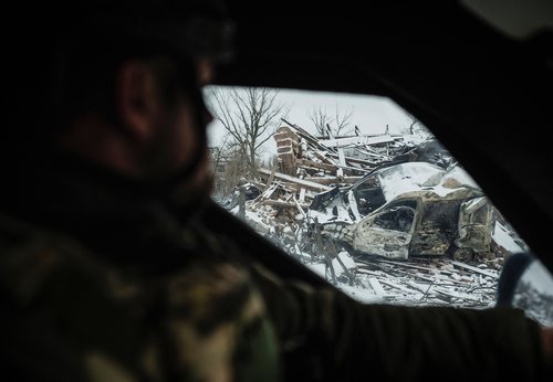 A member of the White Angels police evacuation unit rides in an armoured vehicle during an evacuation from the town of Druzhkivka, amid Russia's attack on Ukraine, in Donetsk region, Ukraine January 24, 2026. REUTERS/Serhii Korovainyi
