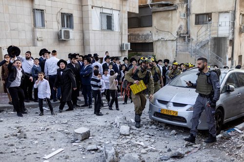 Ultra-Orthodox Jewish Israelis gather at the scene where damage was caused by missiles launched towards Israel from Iran following strikes by Israel and the U.S. on Iran, in Bnei Brak, Israel February 28, 2026.
