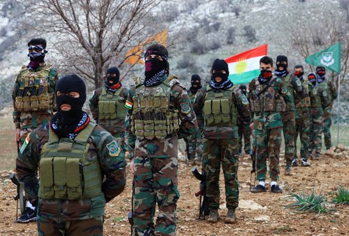 Iranian Kurdish fighters from the Kurdistan Freedom Party (PAK) take part in a training session at a base on the outskirts of Erbil