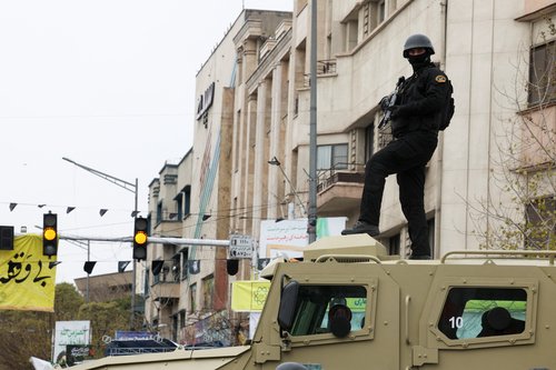 A security personnel stands guard as Iranians take part in a protest marking the annual al-Quds Day (Jerusalem Day) on the last Friday of the holy month of Ramadan in Tehran, Iran, March 13, 2026. REUTERS/Alaa Al Marjani
