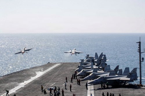 Two F/A-18 Super Hornets launch from the flight deck of the U.S. Navy Nimitz-class aircraft carrier USS Abraham Lincoln in support of the Operation Epic Fury attack on Iran from an undisclosed location March 3, 2026.