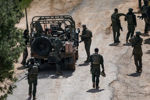 Israeli soldiers gather on the Israeli side of the border with Lebanon, amid escalation between Hezbollah and Israel, and amid the U.S.-Israeli conflict with Iran, in northern Israel, March 16, 2026.