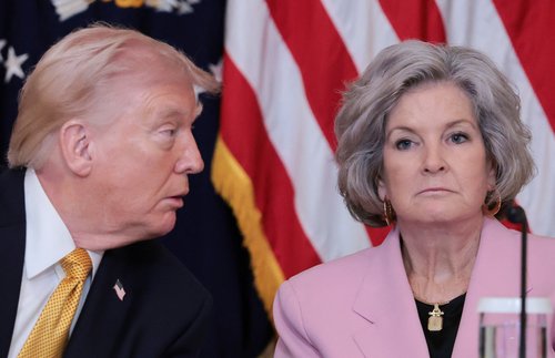 U.S. President Donald Trump approaches White House chief of staff Susie Wiles during a lunch with the Kennedy Center board members in the East Room of the White House in Washington, D.C.