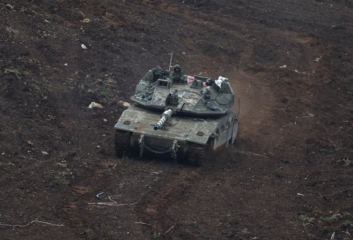 An Israeli tank manoeuvers on the Israeli side of the Israel-Lebanon border, amid escalation between Hezbollah and Israel, and amid the U.S.-Israeli conflict with Iran, in northern Israel