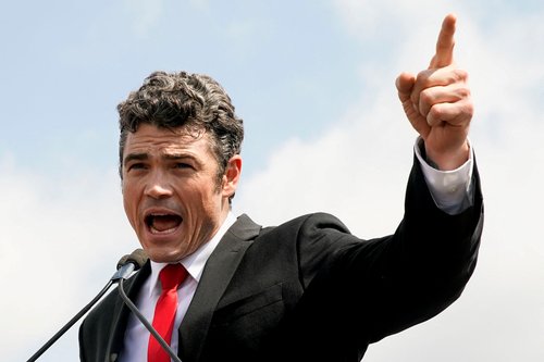 FILE PHOTO: Joe Kent, who is running for Washington's 3rd congressional district, delivers a speech during a rally in support of defendants being prosecuted in the January 6 attack on the Capitol, in Washington