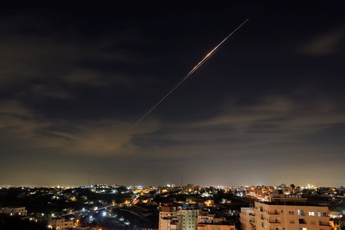 Iranian missiles fly towards Israel, amid the U.S.-Israeli conflict with Iran, as seen from Hebron, in the Israeli-occupied West Bank, March 23, 2026. Picture taken with a long exposure. REUTERS/Mussa Qawasma