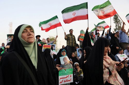 FILE PHOTO: People attend a gathering to support Iran's Armed Forces, after U.S. President Donald Trump announced a ceasefire between Israel and Iran, in Tehran, Iran, June 24, 2025.