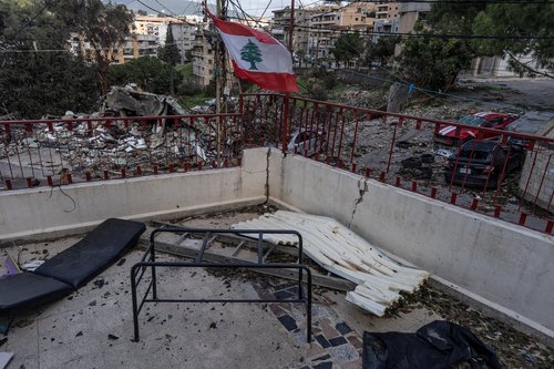 The Lebanese flag flies among the remains of medical supplies at a Lebanese Civil Defence post destroyed by an Israeli strike, amid escalating hostilities between Israel and Hezbollah, as the U.S.-Israeli conflict with Iran continues