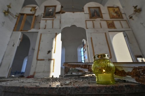 Bethlehem Fire left by Ukrainian police officer in damaged church in Orikhiv
